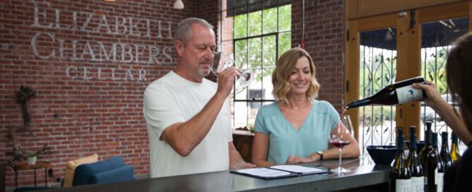 A couple enjoying a wine tasting at Elizabeth Chambers Cellar.